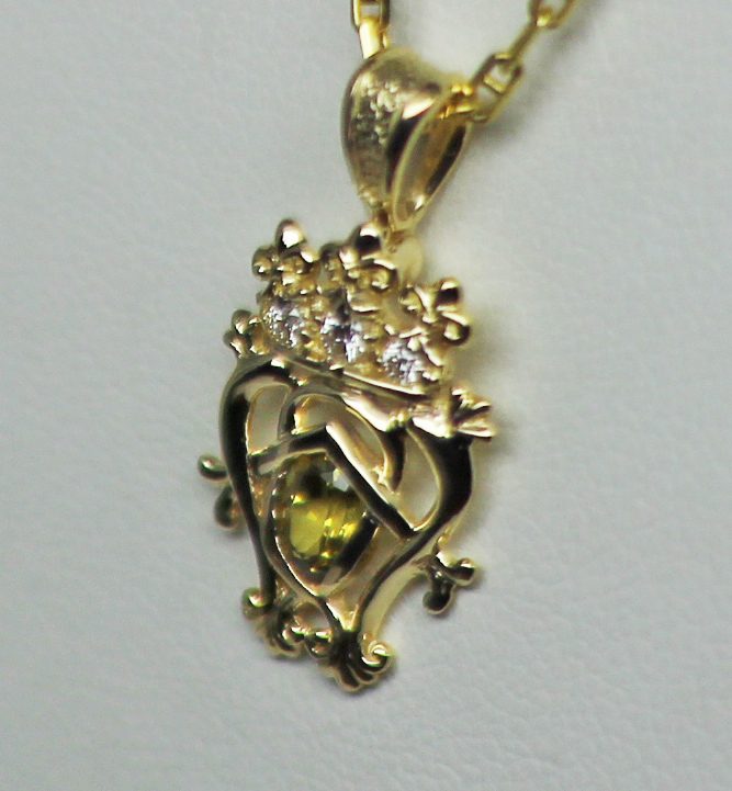 Scottish Citrine Luckenbooth Pendant A Traditional Scottish luckenbooth in 14K, set with three diamonds