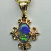 Victorian Black Opal pendant in 18K, by George.