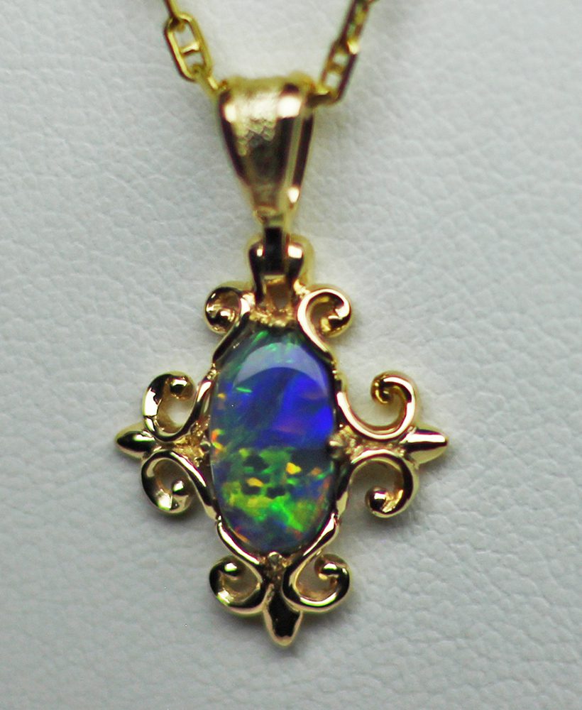 Victorian Black Opal pendant in 18K, by George.