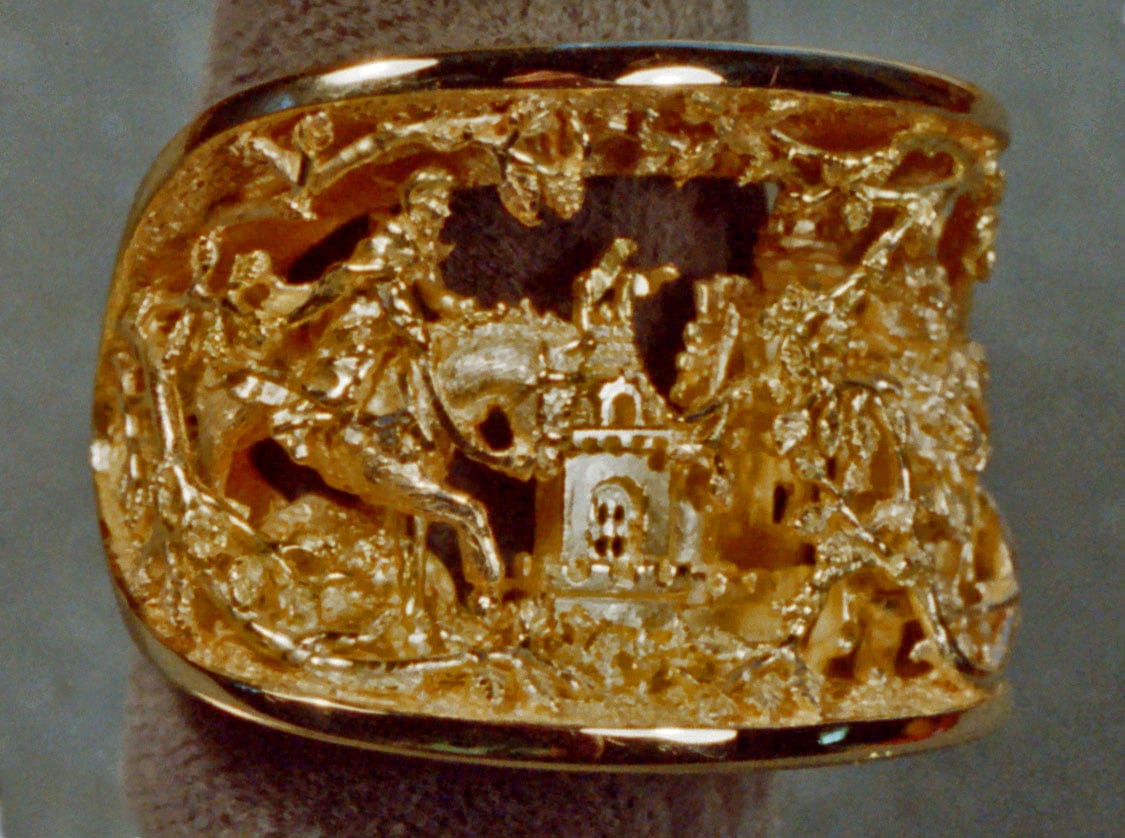 Beauty and the Beast ring in 18K by George Postgate. Beauty's father sees the blue rose.
