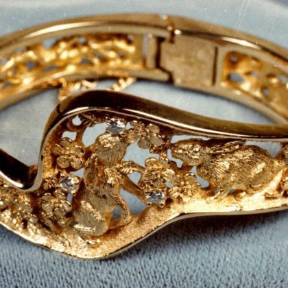Bunny bracelet in 18k with flowers and diamonds by George Postgate