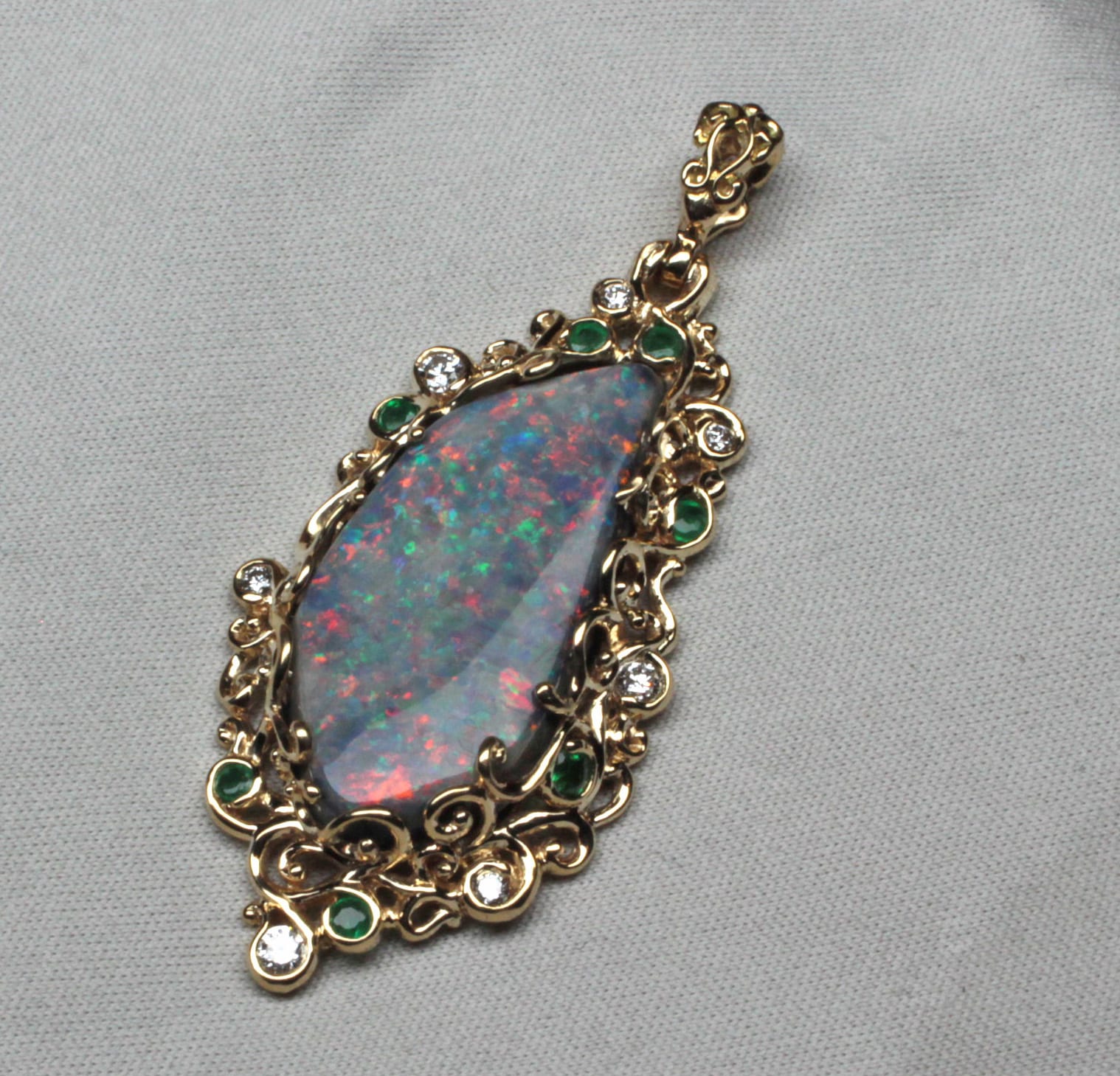 Australian Black Pin-Fire Opal Pendant in lacy 14k gold setting With Emerald and Diamond Accent Stones