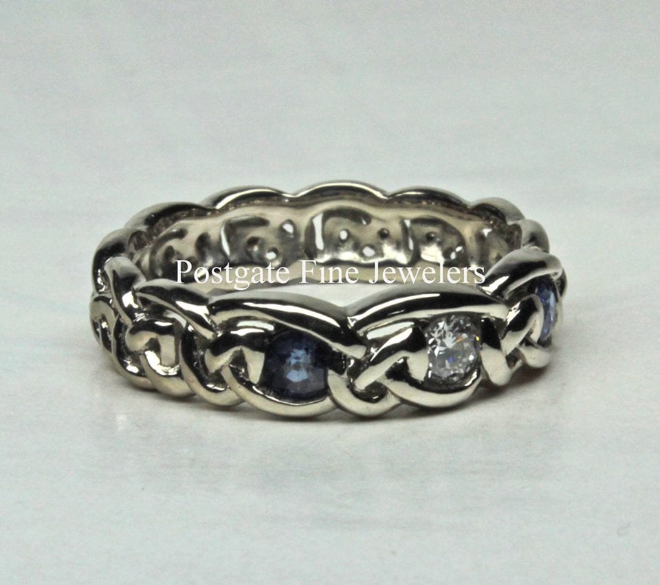 Simple sapphire and diamond Celtic knot band in 14K white gold by George Postgate