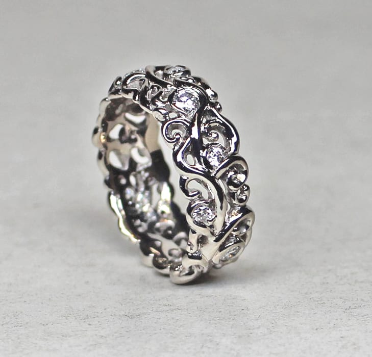 Petite swirling mists of Avalon band in 14K palladium white gold. by George Postgate