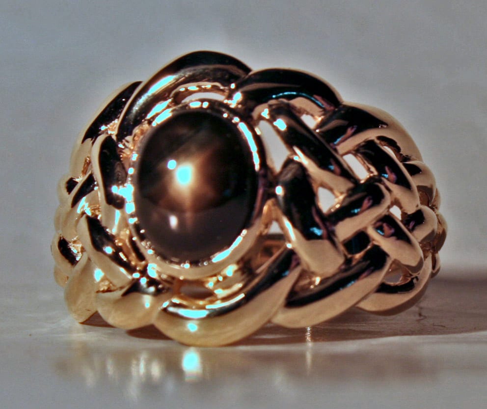 Mans Celtic knot ring with black star sapphire in 14K by George Postgate