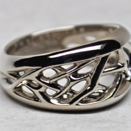 Open frost crystal band design in 14K palladium white gold. by George Postgate