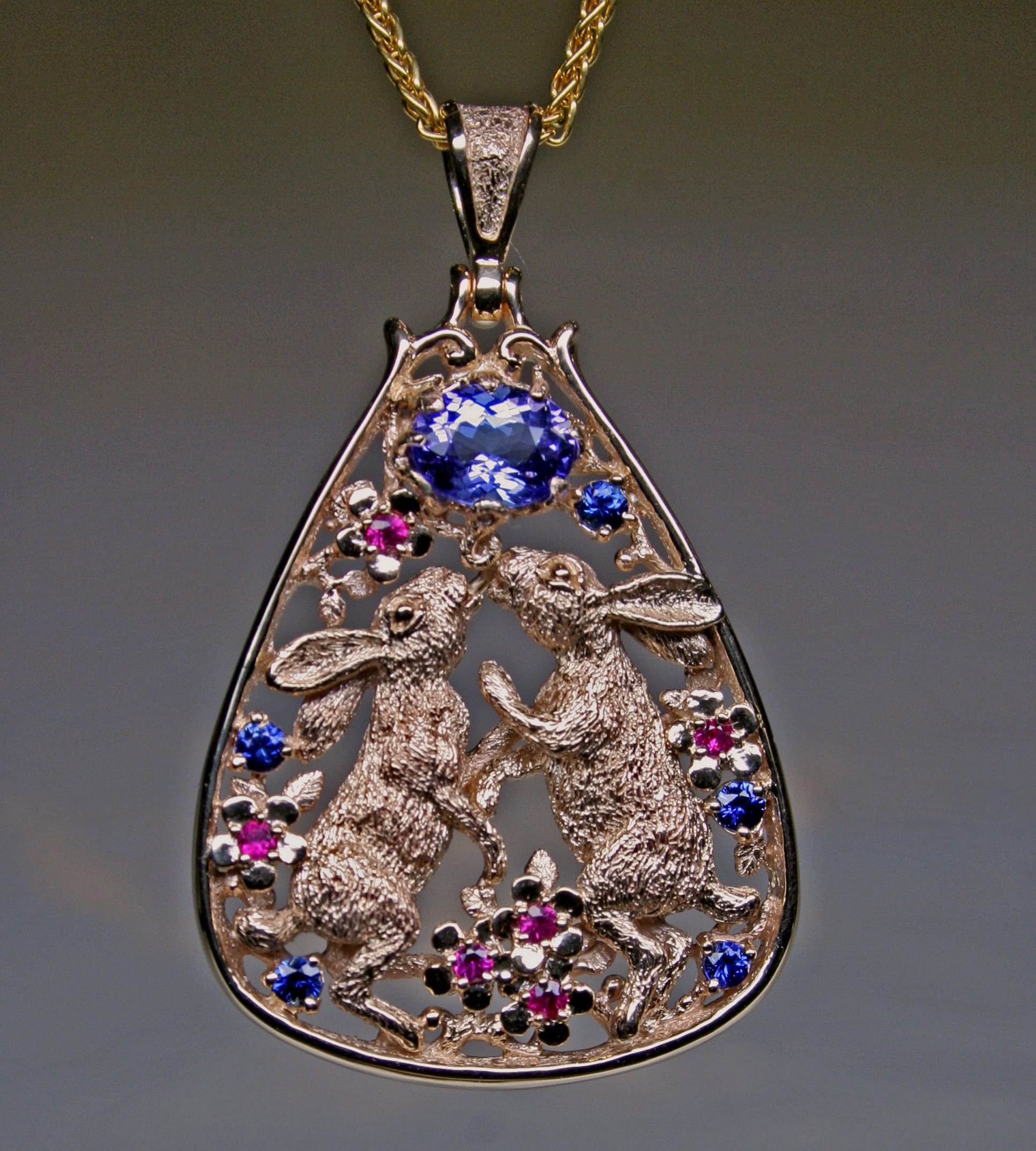 Dancing bunnies pendant in rose gold and precious stones by George Postgate