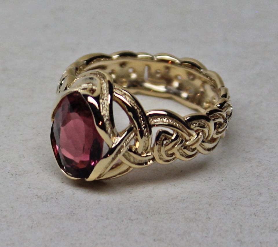 jewelry designs Celtic knot setting in 18K with tourmaline by George Postgate