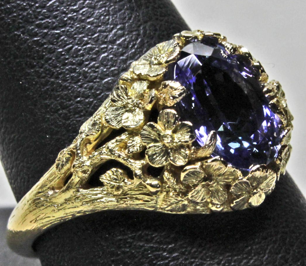 Tanzanite flower ring in 18K by George Postgate