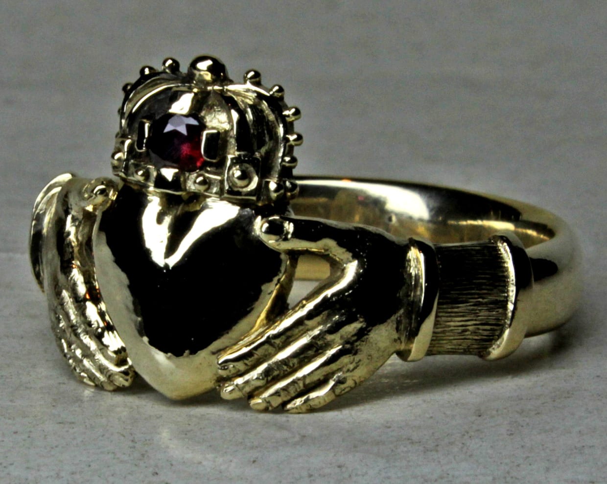 Mans large Irish claddagh ring in 14K with ruby by George Postgate