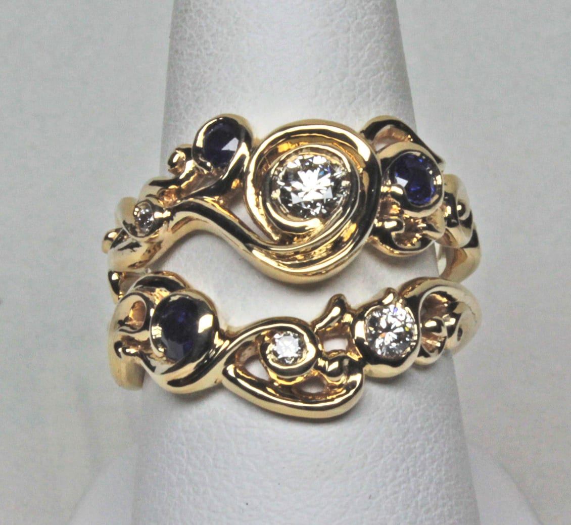 Swirl wedding ring, engagement ring set with sapphires and diamonds by George Postgate