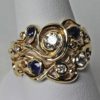 Swirl Wedding Ring set in 18K Gold Sapphires and Diamonds Size 6