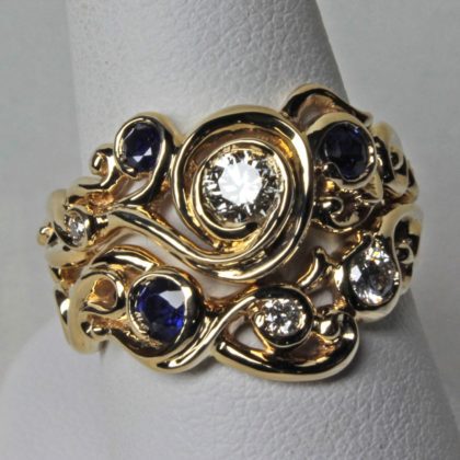 Swirl Wedding Ring set in 18K Gold Sapphires and Diamonds Size 6