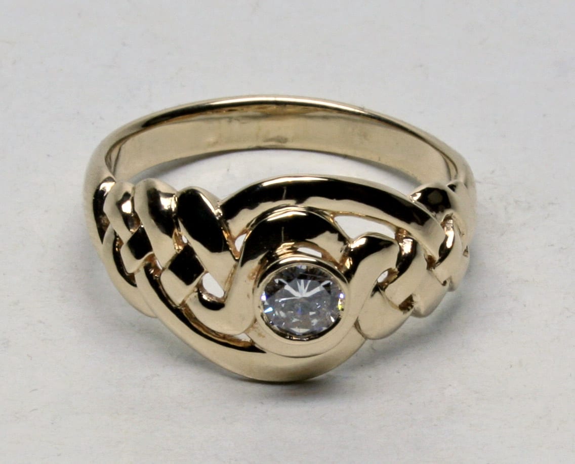 Celtic knot ring with bezel set diamond in 14K by George Postgate
