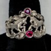 Double Unicorn ring in white 14K gold and fine natural rubies by George Postgate.