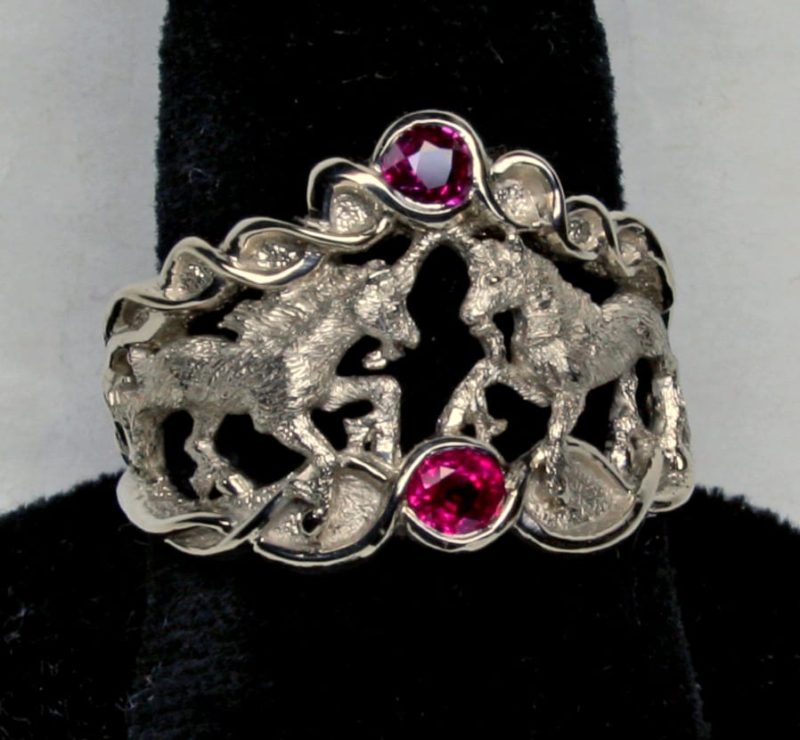 Double Unicorn ring in white 14K gold and fine natural rubies by George Postgate.