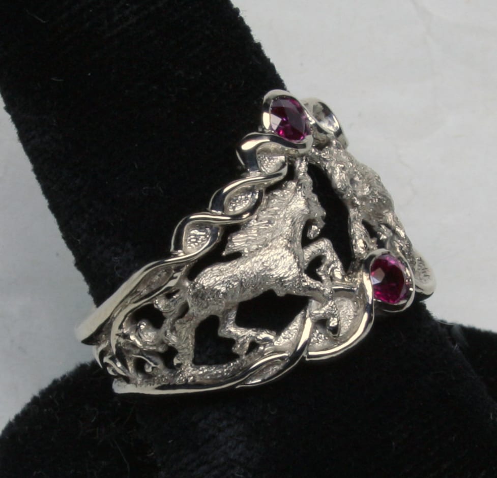 Double Unicorn Ruby Ring, magic white gold and fine rubies.