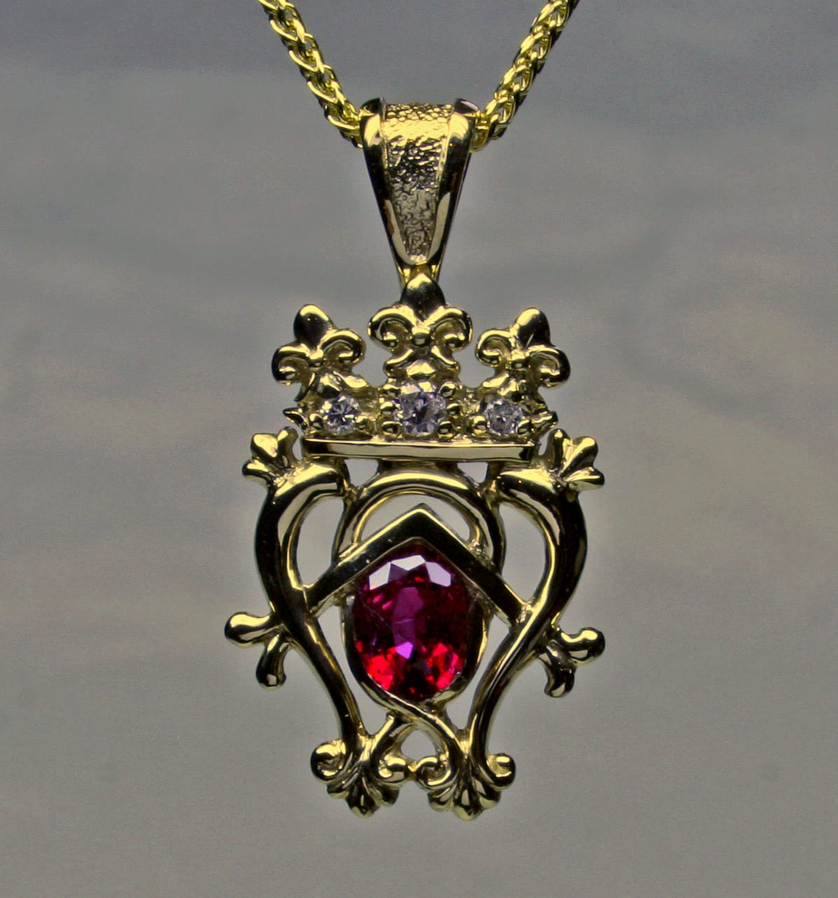 Scottish Luckenbooth pendant in 18K with garnet and diamonds jewelry design by George Postgate