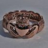 Traditional Irish Claddagh ring with Celtic knot-work band