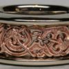 A Viking Gripping Beast wedding band in rose 14K, and white 14K gold. The borders of the rings are high enough to protect the very fine details of the rose gold center. Designed and made by George Postgate.