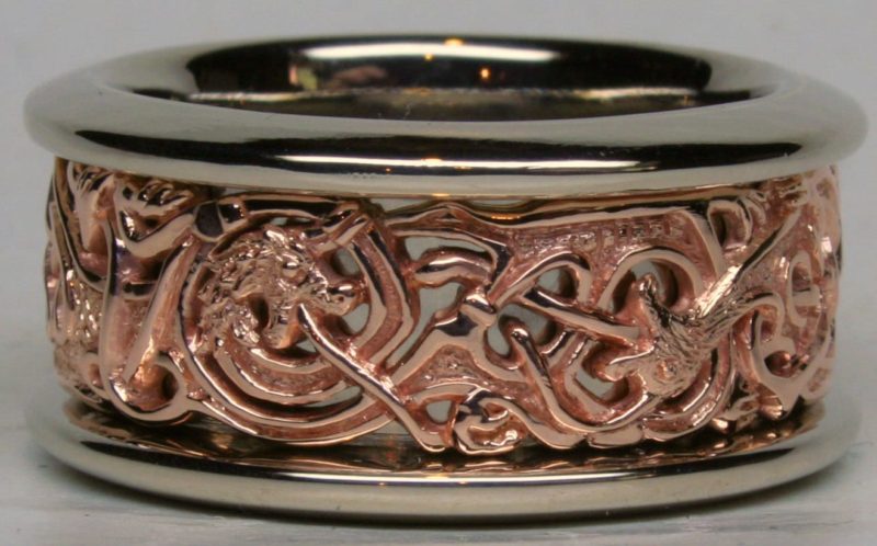 A Viking Gripping Beast wedding band in rose 14K, and white 14K gold. The borders of the rings are high enough to protect the very fine details of the rose gold center. Designed and made by George Postgate.