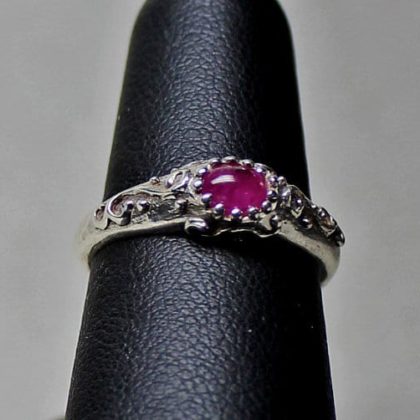 Ancient to modern style sterling silver ring with a natural oval pink sapphire size 6