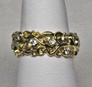 Petite swirling mists of Avalon band in 18K set with diamonds. by George Postgate