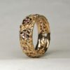 Flower band set with pink sapphires in 18K by George Postgate