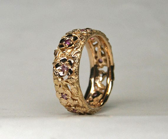 Flower band set with pink sapphires in 18K by George Postgate