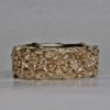 Simple flower band in 14K by George Postgate