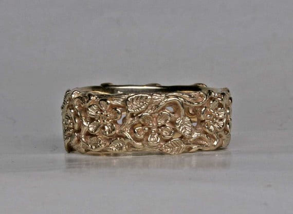 Simple flower band in 14K by George Postgate