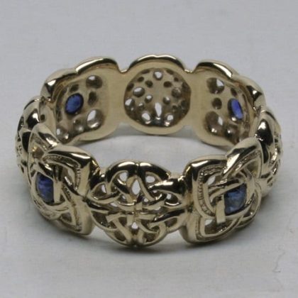 eight knot Celtic band with four sapphires by George Postgate