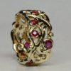 Large swirling mists of Avalon band in 18K set with fine rubies by George Postgate