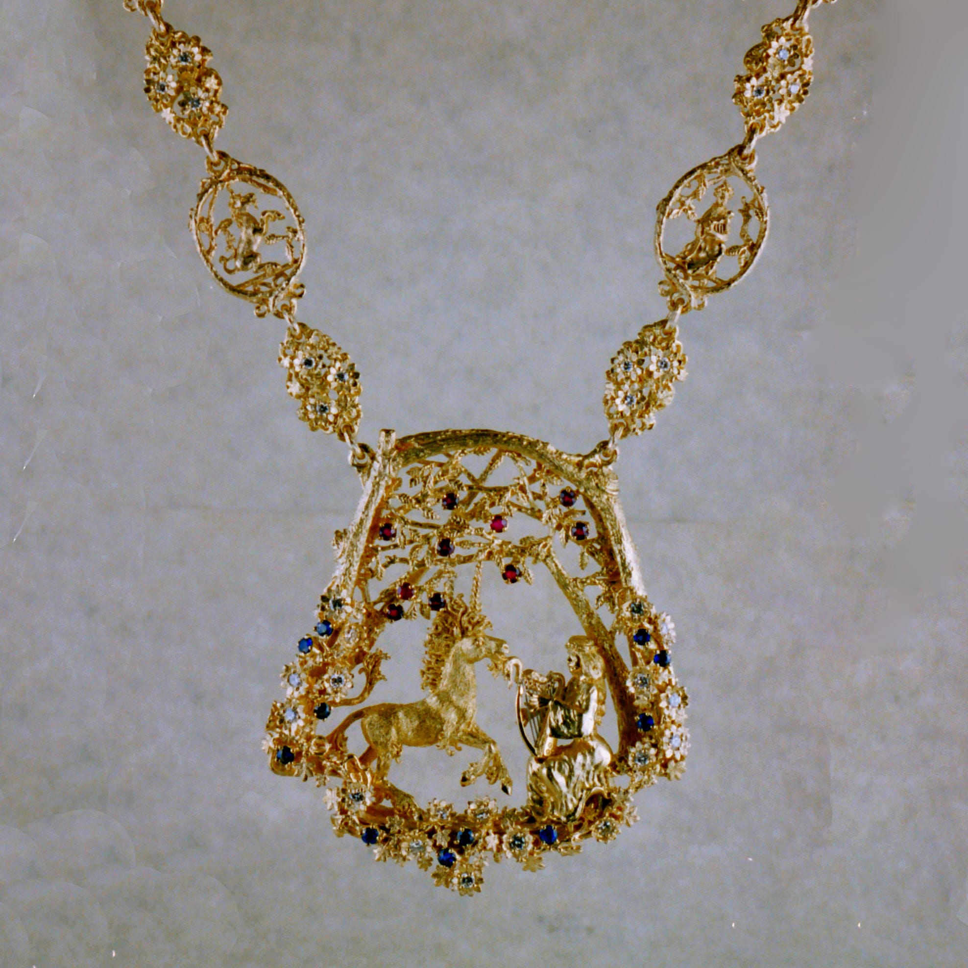 Unicorn and maiden necklace in 18K by George Postgate