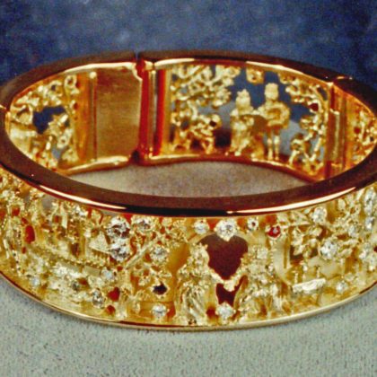 Beauty and the Beast Bracelet in 18K with diamonds, rubies, and sapphires by George Postgate