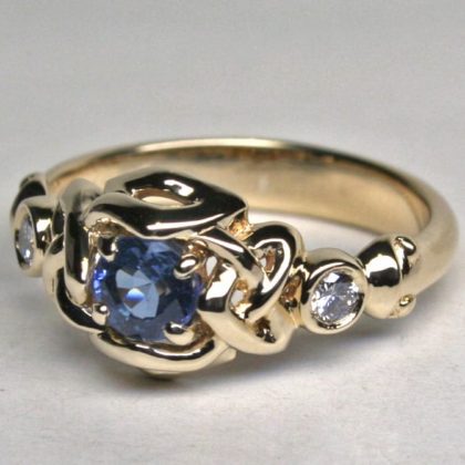 Celtic heart simple knot ring with sapphire and two diamonds. By George