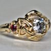 Celtic three stone engagement ring with rubies and one ct diamond by George Postgate