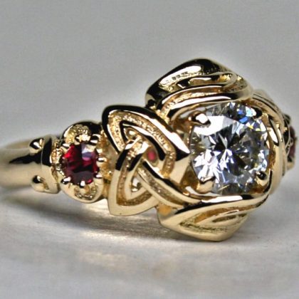 Celtic three stone engagement ring with rubies and one ct diamond by George Postgate