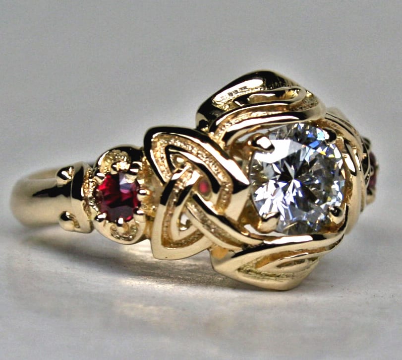 Celtic three stone engagement ring with rubies and one ct diamond by George Postgate