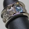 Thistle band with rainbow moonstone in 14K palladium white gold, by George Postgate
