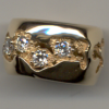 Geologicaly inspired diamond band in 18K by George Postgate