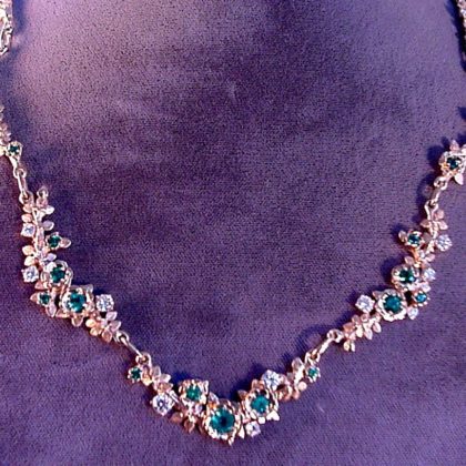 special order Gold Rose necklace with diamonds and emeralds by George Postgate