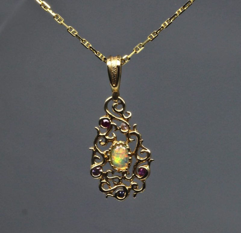 Curvilinear Pendant with sapphire ruby and opal in 14K by Suzan