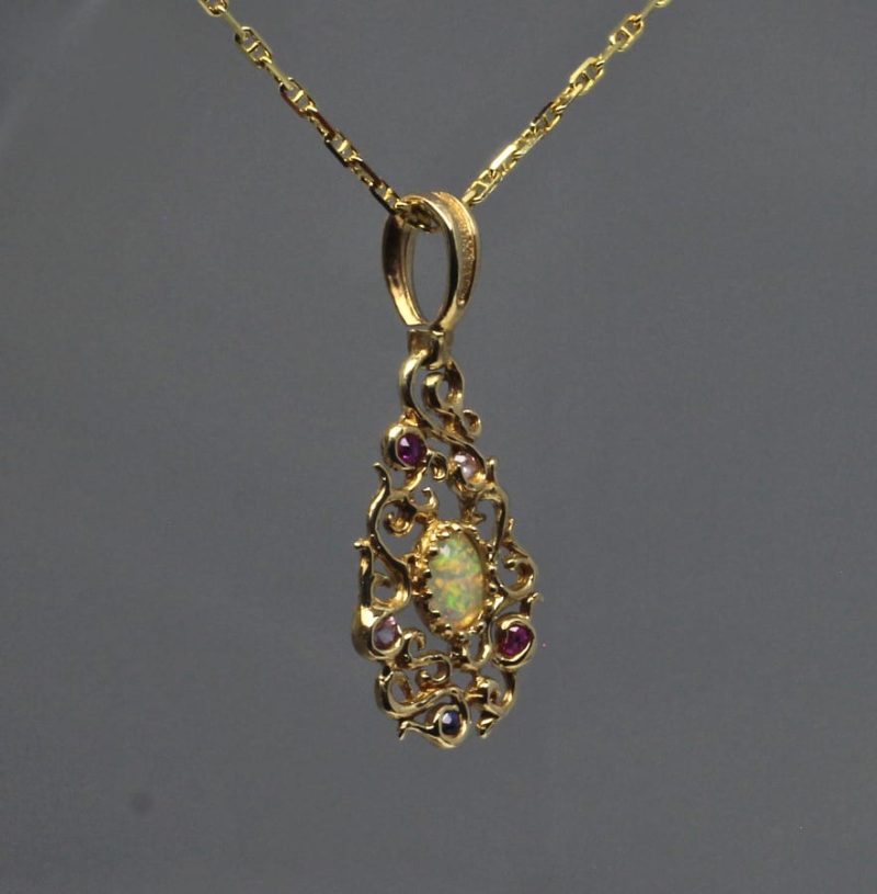Curvilinear Pendant with sapphire ruby and opal in 14K by Suzan