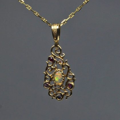 Curvilinear Pendant with sapphire ruby and opal in 14K by Suzan