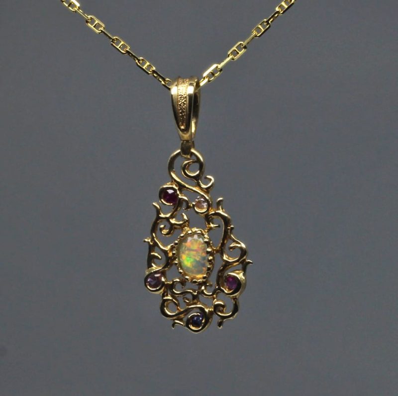 Curvilinear Pendant with sapphire ruby and opal in 14K by Suzan