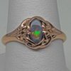 Celtic black opal rose gold ring