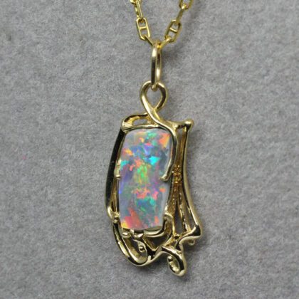 Art Nouveau opal pendant, Here is my semi black opal pendant finished. This opal is among my all time favorites. It comes from Lightning Ridge Australia, the source of the finest black opals.