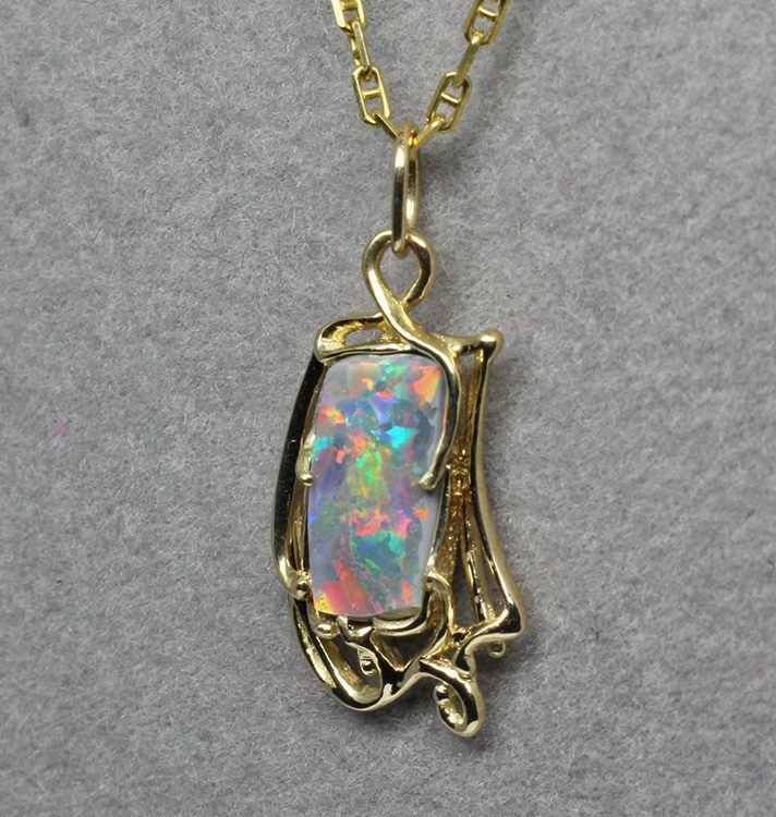Art Nouveau opal pendant, Here is my semi black opal pendant finished. This opal is among my all time favorites. It comes from Lightning Ridge Australia, the source of the finest black opals.