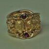 Lions & Dragon ring in gold with rubies
